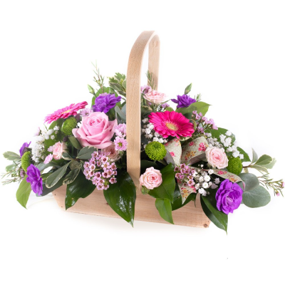 Bon Bon - Shower them with love with this cutesy collection of seasonal flowers in pretty pastels. Beautifully arranged and stylishly presented in a traditional basket.